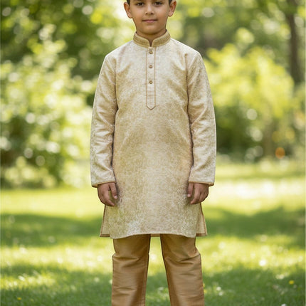 Kurti Connection USA boys cream jacquard kurti with embroidered mandarin collar and gold pajama pants in a park