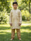 Kurti Connection USA boys cream jacquard kurti with embroidered mandarin collar and gold pajama pants in a park
