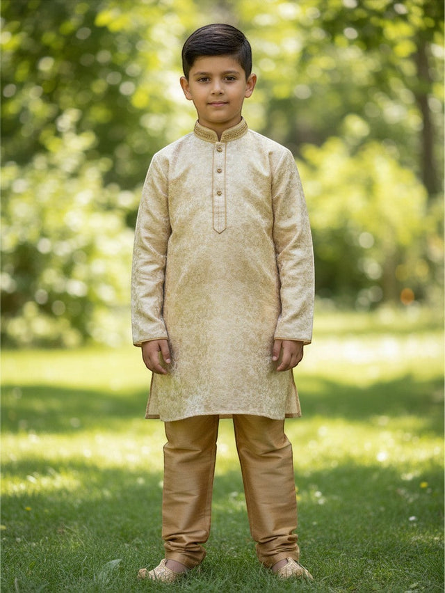 Kurti Connection USA boys cream jacquard kurti with embroidered mandarin collar and gold pajama pants in a park