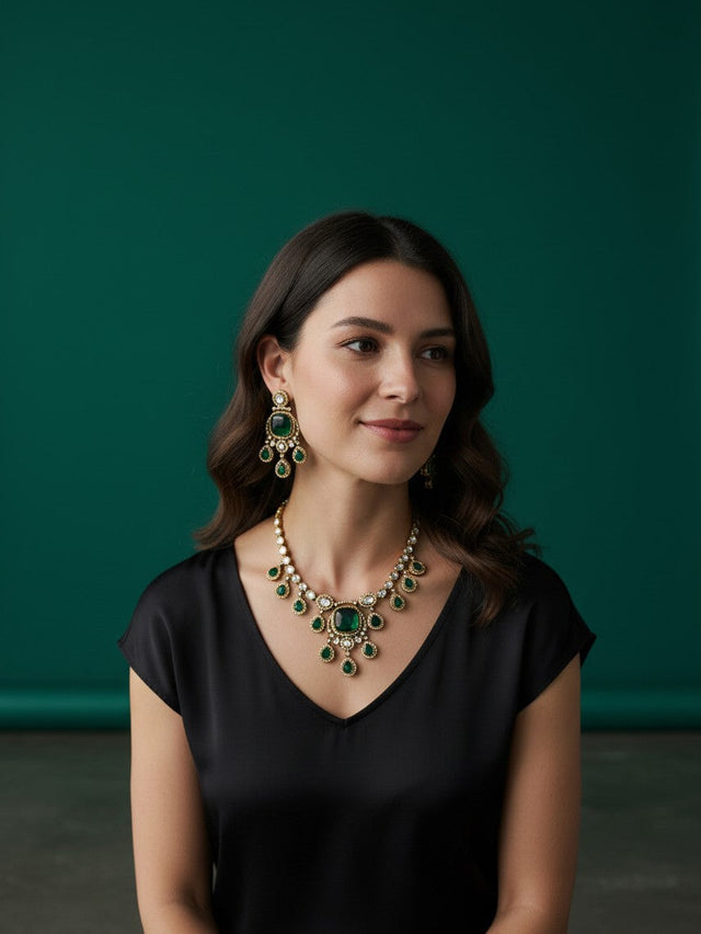Kurti Connection USA emerald green doublet stone necklace and earring set worn by a woman in a black top
