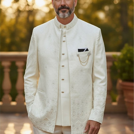 Man wearing a Kurti Connection USA off-white three-piece Indo-Western sherwani with intricate embroidery and gold chain