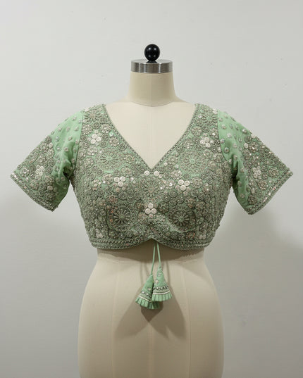 Posts green color blouse