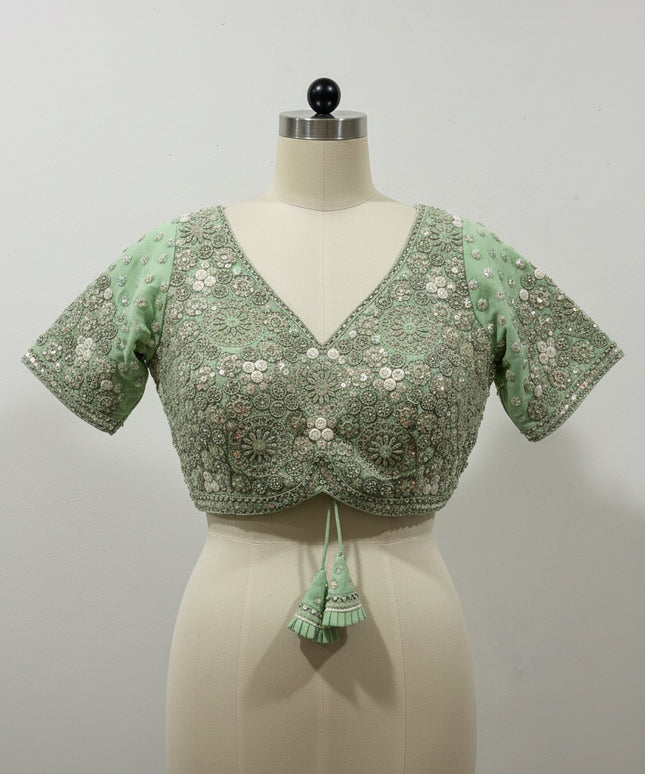 Posts green color blouse