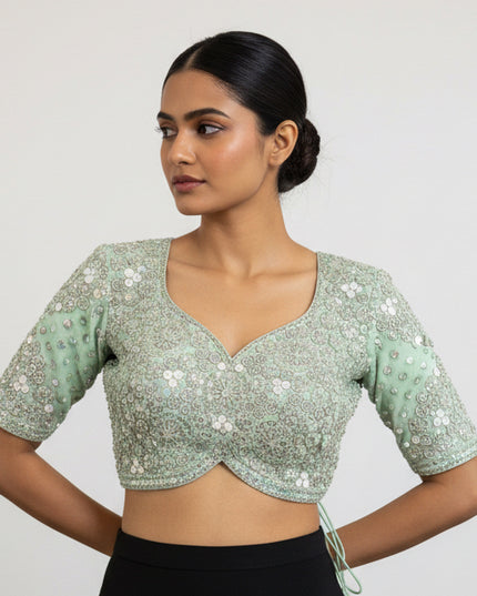 Posts green color blouse