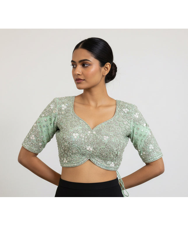 Posts green color blouse