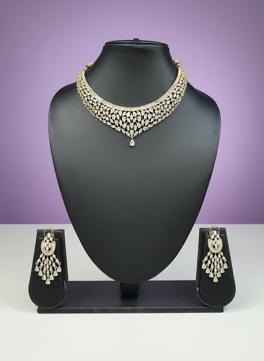 House Of Indian Wedding Attire gold-toned choker necklace with V-shape design and matching drop earrings, adorned with cubic zirconia stones.