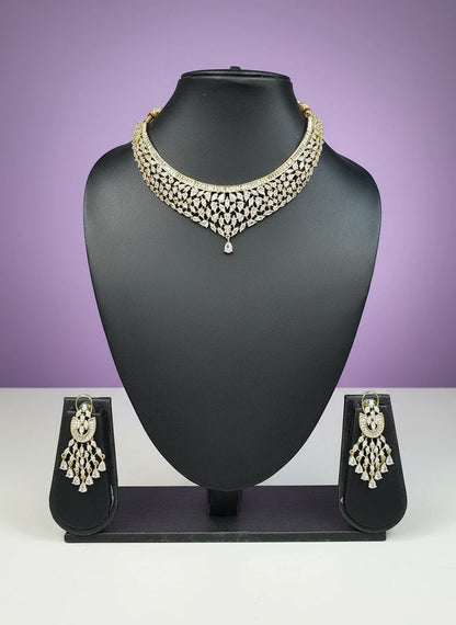 House Of Indian Wedding Attire gold-toned choker necklace with V-shape design and matching drop earrings, adorned with cubic zirconia stones.