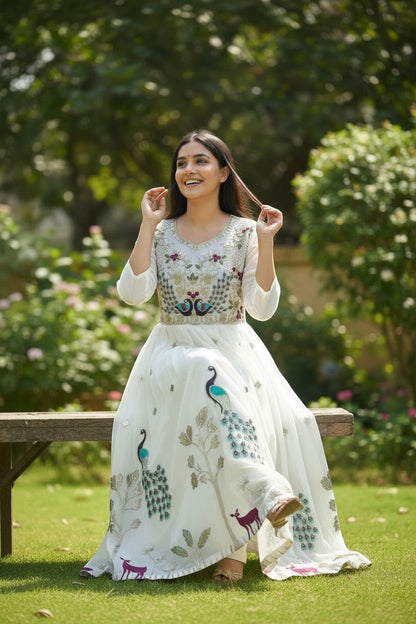 House Of Indian Wedding Attire white chiffon long kurti with embroidered peacock and deer motifs. Elegant Indian ethnic wear.