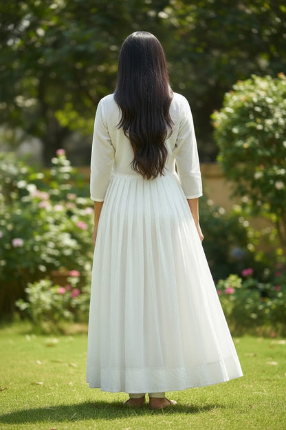 House Of Indian Wedding Attire white chiffon long kurti with pleated skirt and embroidered peacock detail.