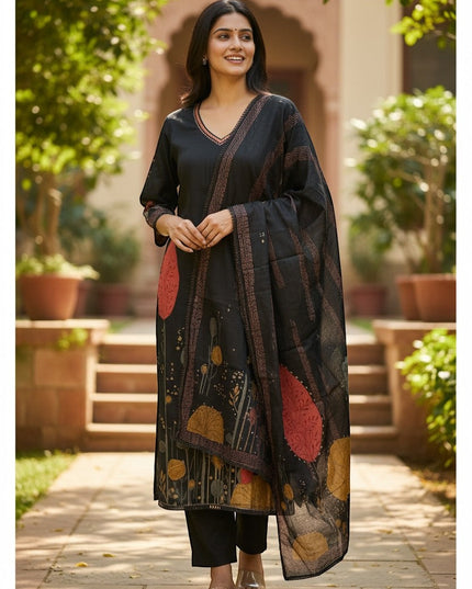Kurti Connection USA black kurti set with abstract floral print, V-neck, full sleeves, matching dupatta, and black pants. Model is outdoors.