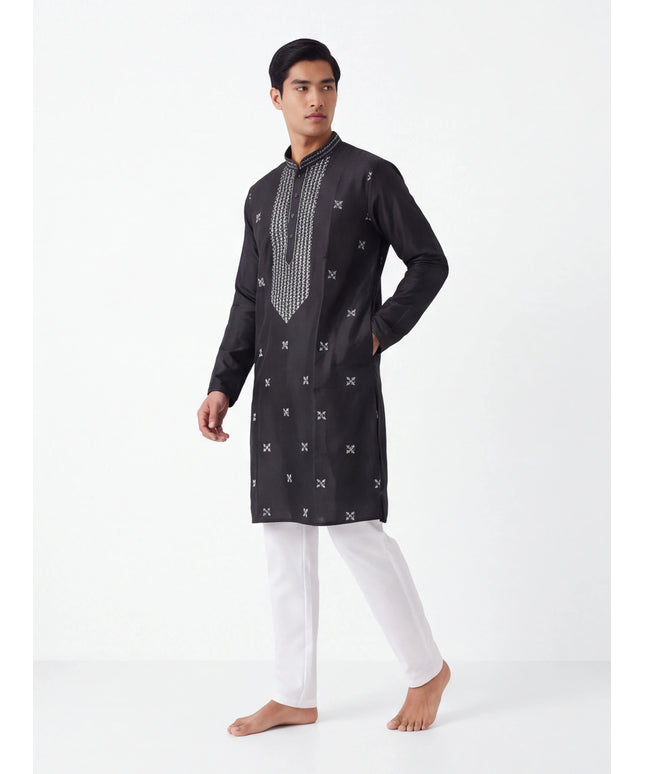 Kurti Connection USA black silk kurta with white geometric embroidery, mandarin collar, and white trousers on a model