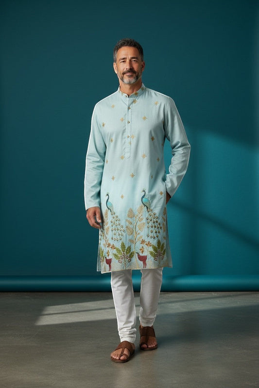 Kurti Connection USA light blue silk kurta set with intricate peacock and deer embroidery, paired with white pajama.