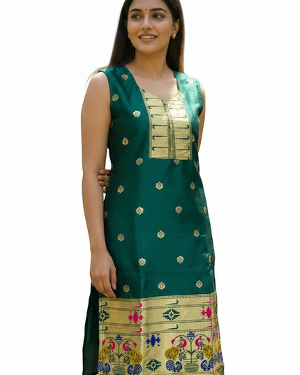 Kurti Connection USA emerald green silk sleeveless kurta with gold zari motifs, embellished neckline, and peacock border. Model is wearing it for a festive occasion.