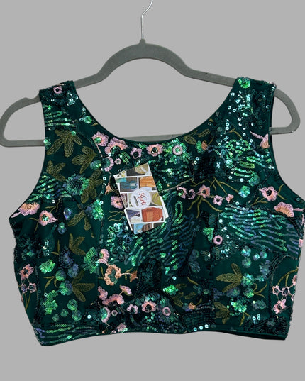 Kurti Connection USA emerald green sleeveless crop top with floral embroidery and shimmering sequins on a hanger