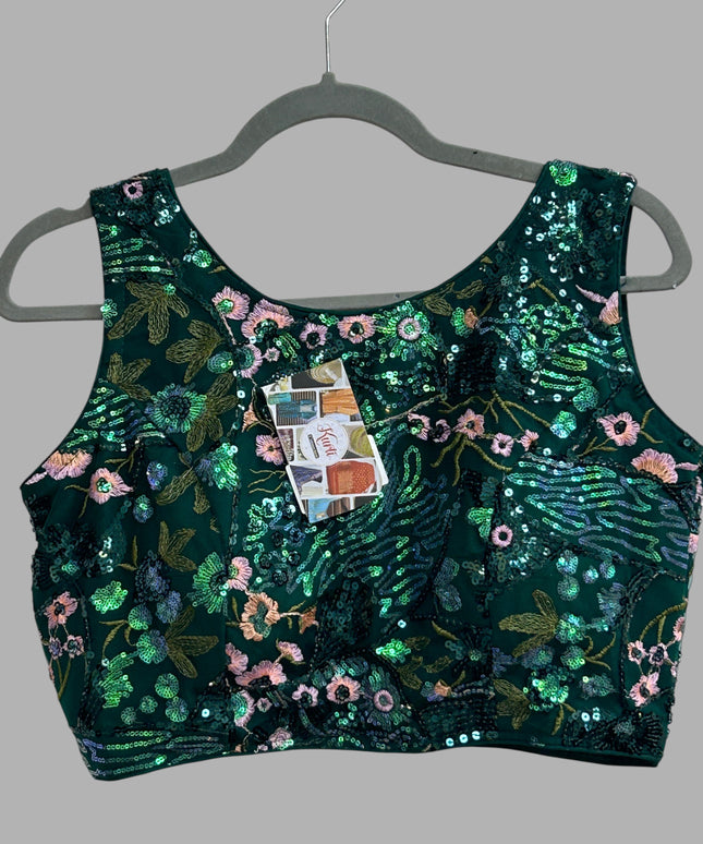 Kurti Connection USA emerald green sleeveless crop top with floral embroidery and shimmering sequins on a hanger
