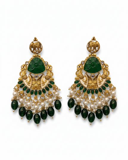 Kurti Connection USA gold-toned jhumki earrings with green stone inlay, elephant motif, and pearl bead dangles.