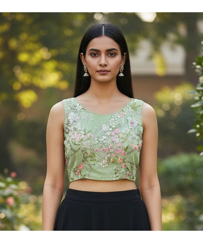 Kurti Connection USA light green boat neck blouse with floral embroidery paired with a long black skirt in a garden