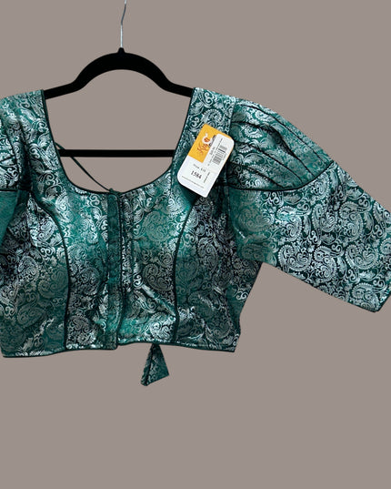 Kurti Connection USA emerald green and silver brocade blouse with a square neckline and puff sleeves.
