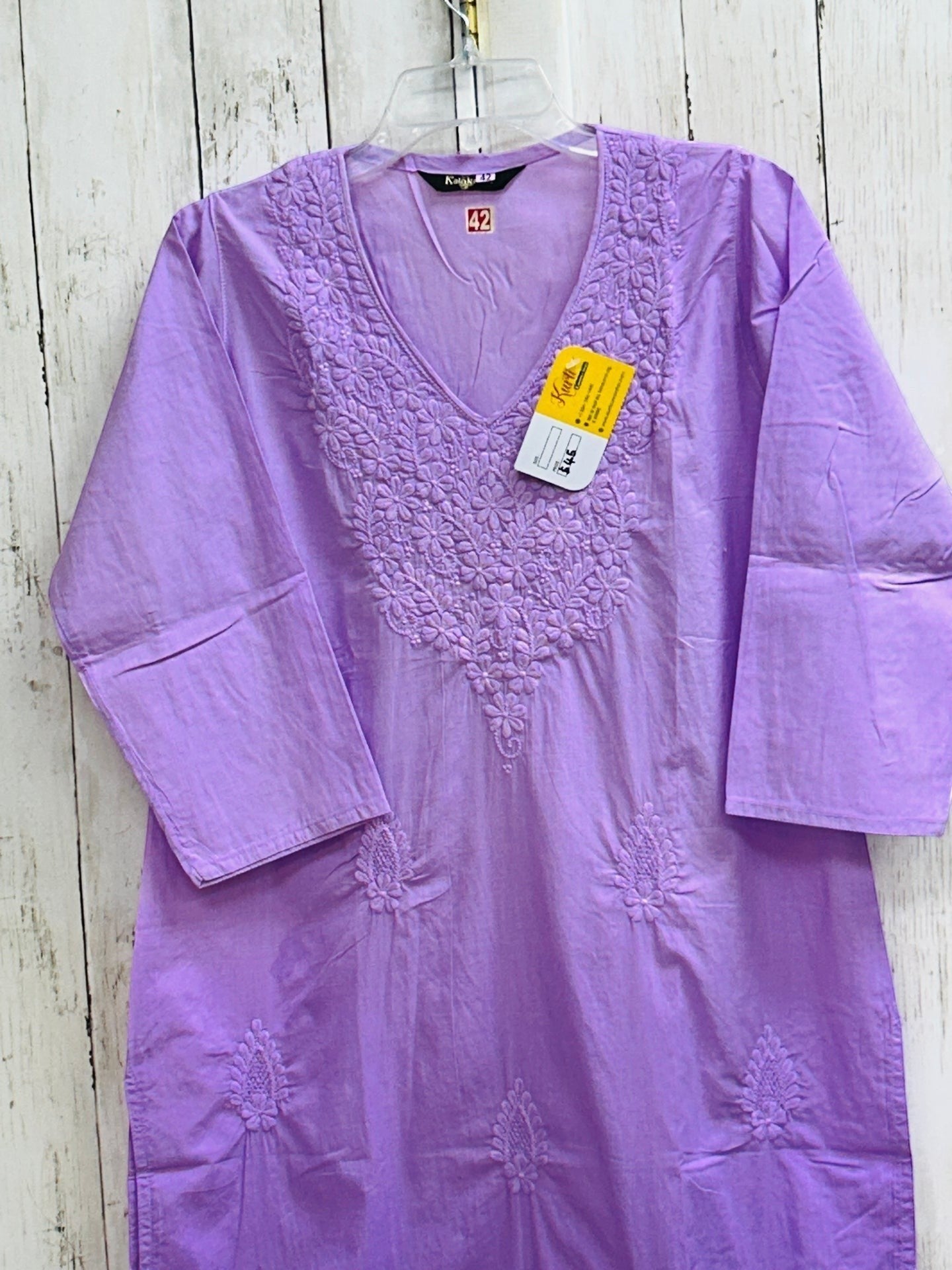 Kurti Connection USA lavender cotton tunic with intricate white floral embroidery and a flattering V-neckline.