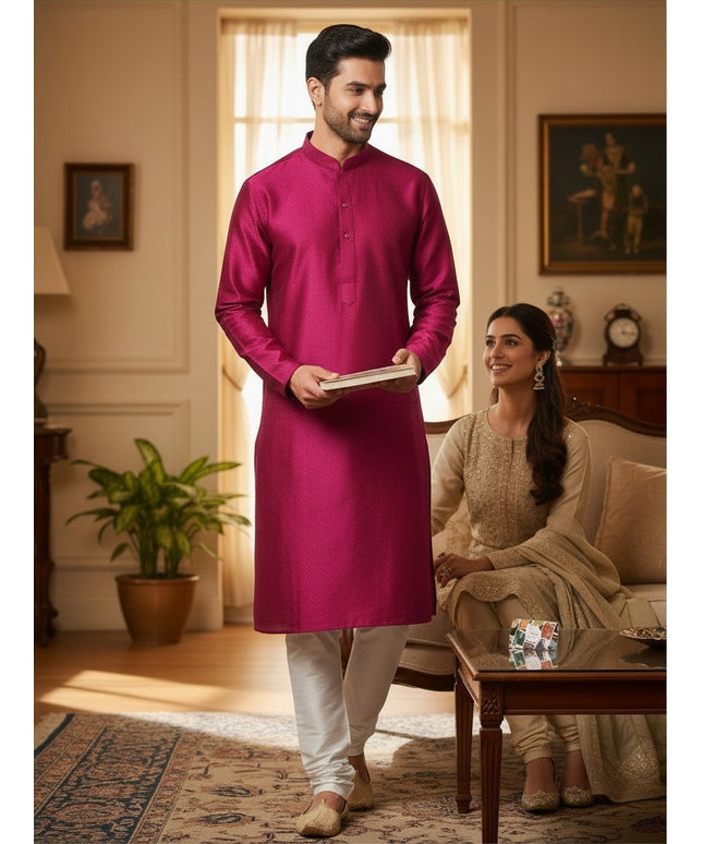 Man wearing a Kurti Connection USA magenta diamond-patterned jacquard kurta with a mandarin collar in a home setting.