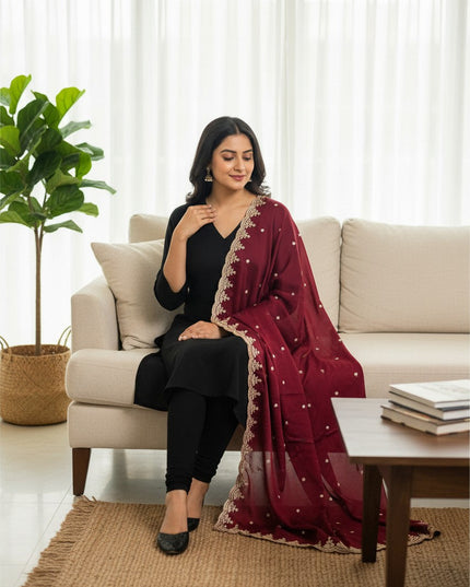 Kurti Connection USA maroon chiffon dupatta with intricate gold Jardoji embroidery draped over a woman in a black suit.