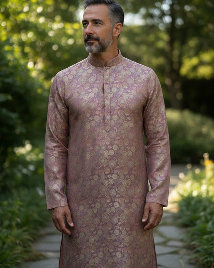 Man wearing a Kurti Connection USA mauve kurta with gold floral motifs, mandarin collar, and long sleeves outdoors.