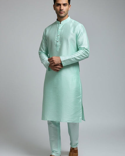 Man wearing a Kurti Connection USA mint green traditional kurta pajama set with a mandarin collar and tailored fit.