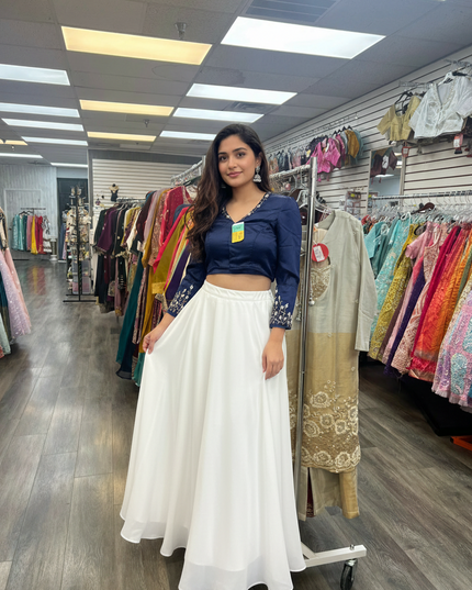 Kurti Connection USA navy blue cropped blouse with intricate embroidery on sleeves paired with a white maxi skirt