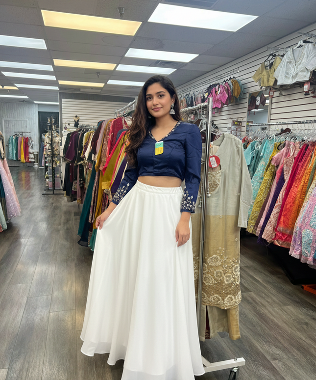 Kurti Connection USA navy blue cropped blouse with intricate embroidery on sleeves paired with a white maxi skirt