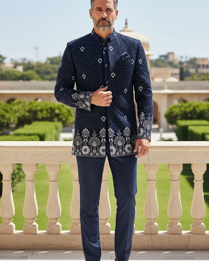 Kurti Connection USA navy blue embroidered Bandhgala suit with silver detailing on collar, cuffs, and hem. Model wears matching trousers.