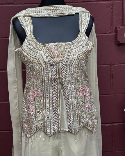 Kurti Connection USA off-white sharara set featuring an intricately beaded sleeveless bodice with floral embroidery.