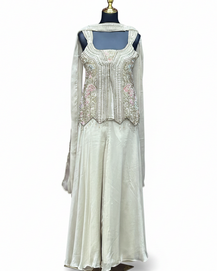 Kurti Connection USA off-white sharara set with embellished sleeveless top, flared pants, and matching dupatta.