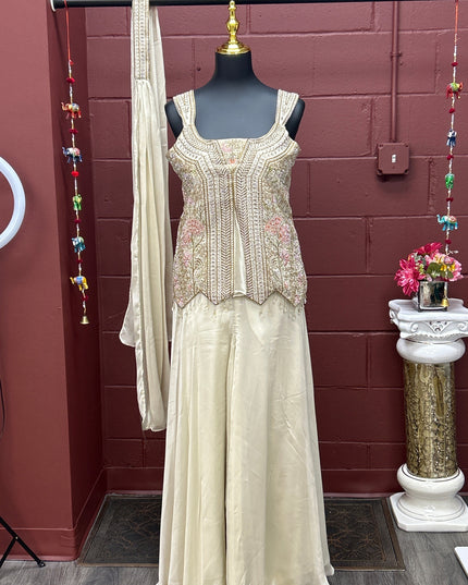 Kurti Connection USA off-white sharara set with intricate gold embroidery, matching dupatta, and decorative necklace.