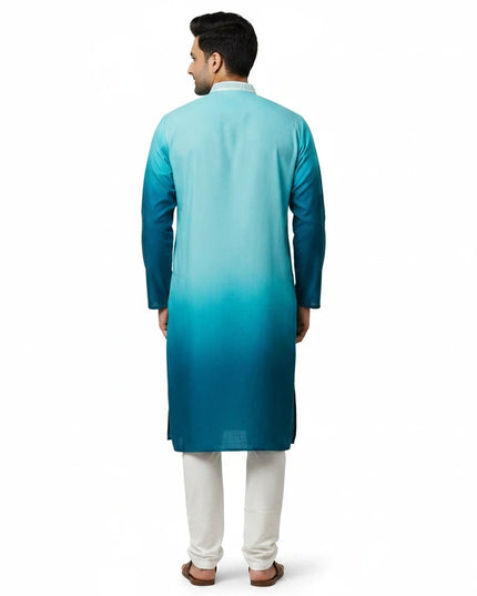 Back view of a man wearing a Kurti Connection USA ombre turquoise to teal kurta with white trousers