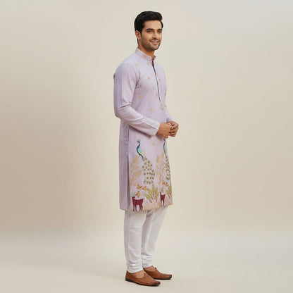 Kurti Connection USA light purple silk kurta set with intricate peacock and deer embroidery, paired with white pajama.
