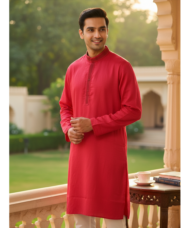 Kurti Connection USA men's red poly silk kurta with textured fabric and mandarin collar, worn by a smiling man.