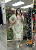 Kurti Connection USA sage green kurti set with multi-colored floral embroidery, round neck, and matching trousers.