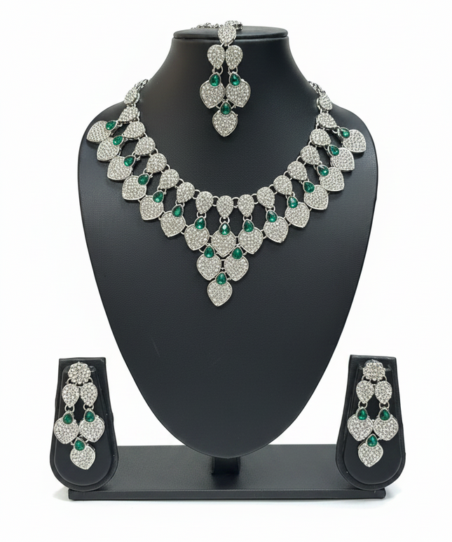 Kurti Connection USA silver-toned necklace set featuring teardrop-shaped crystals and green stone accents