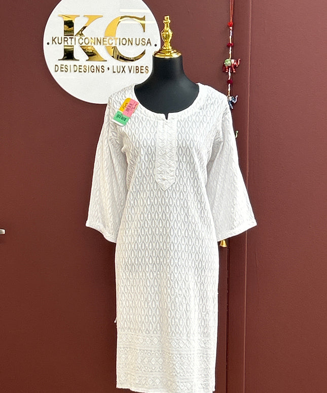 Kurti Connection USA white Chikankari kurti with intricate Lucknowi hand-embroidery, round neckline, and 3/4 sleeves.
